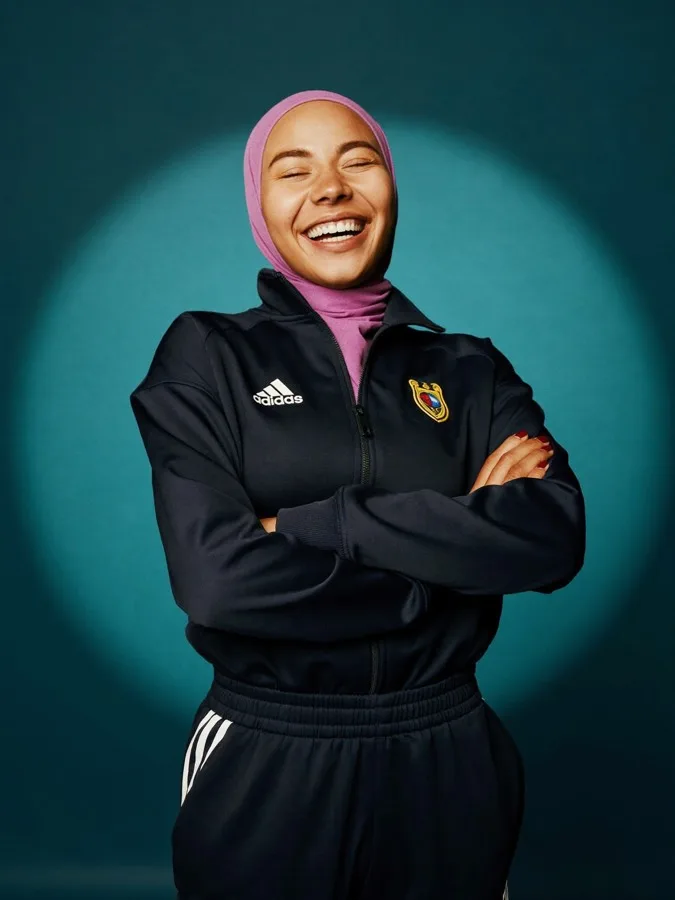 Young athlete smiling in her training kit